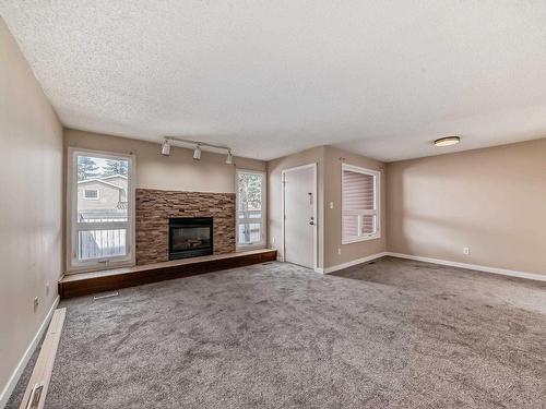 48 1904 48 Street, Edmonton, AB - Indoor Photo Showing Living Room With Fireplace