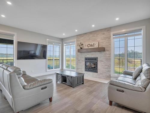 58108 Rge Rd 240, Rural Sturgeon County, AB - Indoor Photo Showing Living Room With Fireplace