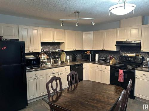 204 592 Hooke Road, Edmonton, AB - Indoor Photo Showing Kitchen With Double Sink