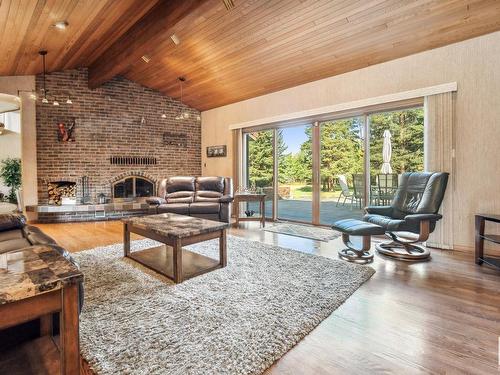 1040 50242 Rge Road 244 A, Rural Leduc County, AB - Indoor Photo Showing Living Room With Fireplace