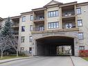 201 160 Magrath Road Nw, Edmonton, AB  - Outdoor With Balcony With Facade 