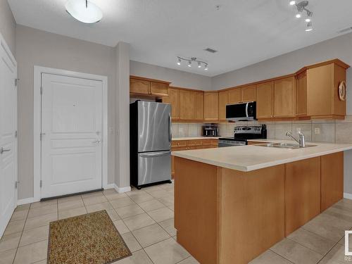 416 160 Magrath Road, Edmonton, AB - Indoor Photo Showing Kitchen With Double Sink