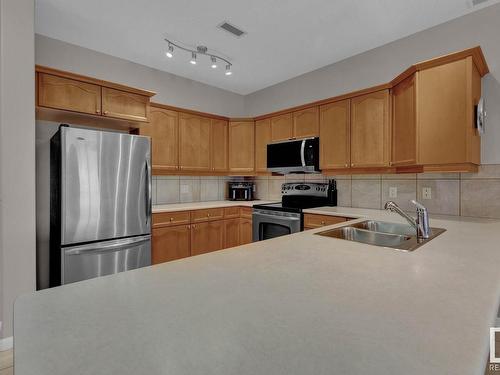 416 160 Magrath Road, Edmonton, AB - Indoor Photo Showing Kitchen With Double Sink