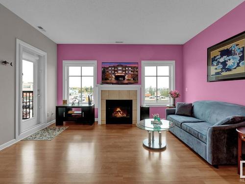 416 160 Magrath Road, Edmonton, AB - Indoor Photo Showing Living Room With Fireplace