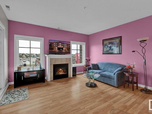 416 160 Magrath Road, Edmonton, AB - Indoor Photo Showing Living Room With Fireplace