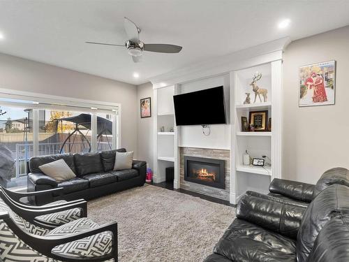 2504 22 Avenue Nw, Edmonton, AB - Indoor Photo Showing Living Room With Fireplace