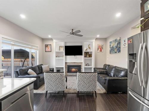 2504 22 Avenue Nw, Edmonton, AB - Indoor Photo Showing Living Room With Fireplace