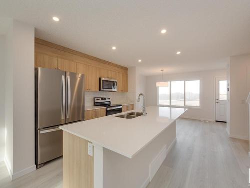 2460 Trumpeter Way, Edmonton, AB - Indoor Photo Showing Kitchen With Stainless Steel Kitchen With Double Sink With Upgraded Kitchen