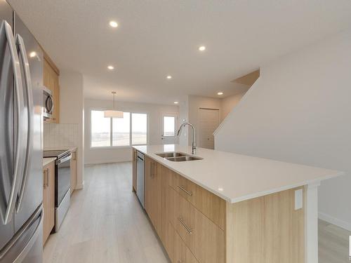 2460 Trumpeter Way, Edmonton, AB - Indoor Photo Showing Kitchen With Stainless Steel Kitchen With Double Sink With Upgraded Kitchen