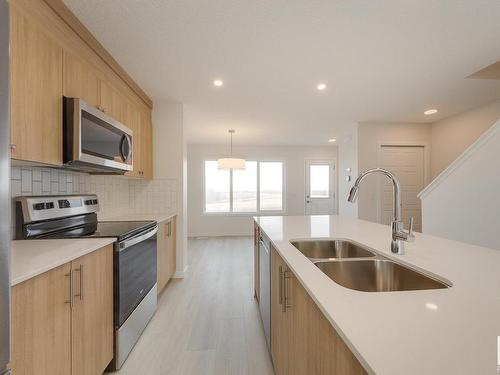 2460 Trumpeter Way, Edmonton, AB - Indoor Photo Showing Kitchen With Stainless Steel Kitchen With Double Sink With Upgraded Kitchen