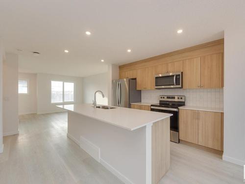 2460 Trumpeter Way, Edmonton, AB - Indoor Photo Showing Kitchen With Stainless Steel Kitchen With Double Sink