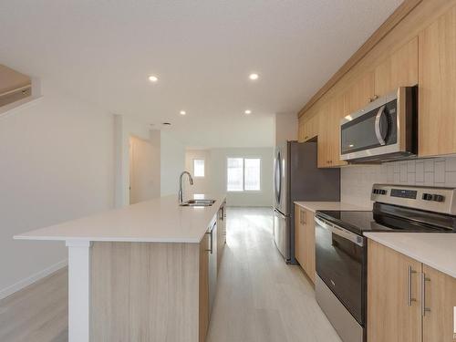 2460 Trumpeter Way, Edmonton, AB - Indoor Photo Showing Kitchen With Stainless Steel Kitchen With Double Sink