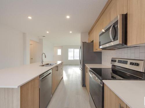 2460 Trumpeter Way, Edmonton, AB - Indoor Photo Showing Kitchen With Stainless Steel Kitchen With Double Sink