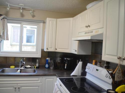 Edmonton, AB - Indoor Photo Showing Kitchen With Double Sink