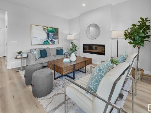 3330 Erlanger Bend Bend, Edmonton, AB - Indoor Photo Showing Living Room With Fireplace