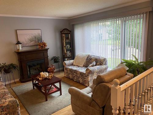 5014 52 Avenue, Calmar, AB - Indoor Photo Showing Living Room With Fireplace