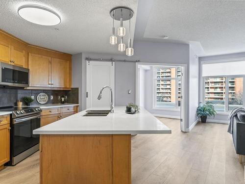 403 9020 Jasper Avenue, Edmonton, AB - Indoor Photo Showing Kitchen With Double Sink