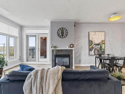 403 9020 Jasper Avenue, Edmonton, AB - Indoor Photo Showing Living Room With Fireplace