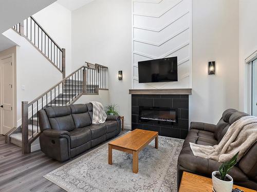 398 Bluff Cove, Leduc, AB - Indoor Photo Showing Living Room With Fireplace