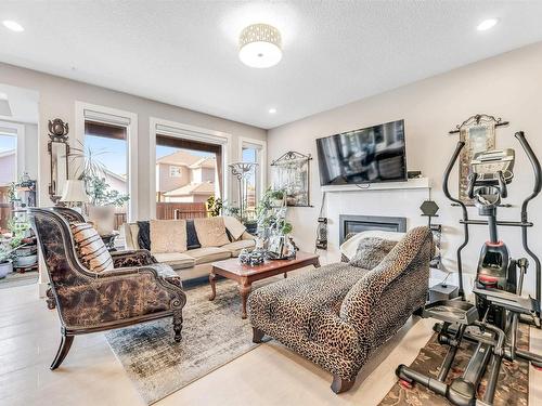 4 Lakeshore Cove, Beaumont, AB - Indoor Photo Showing Living Room With Fireplace