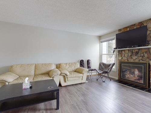 1134 Knottwood E, Edmonton, AB - Indoor Photo Showing Living Room With Fireplace