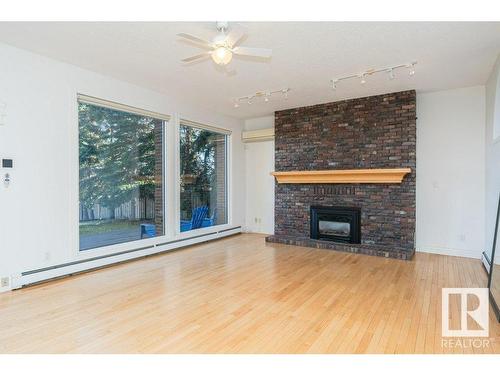 220 Grandisle Point, Edmonton, AB - Indoor Photo Showing Living Room With Fireplace