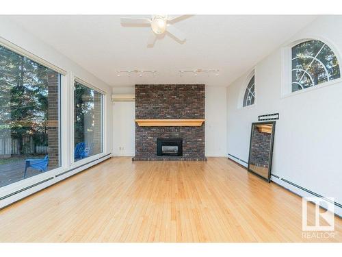 220 Grandisle Point, Edmonton, AB - Indoor Photo Showing Living Room With Fireplace