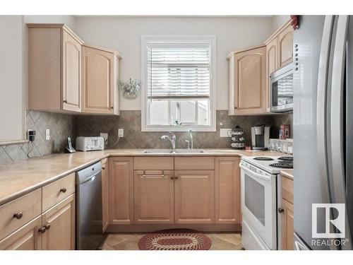 404 10178 117 Street, Edmonton, AB - Indoor Photo Showing Kitchen With Double Sink