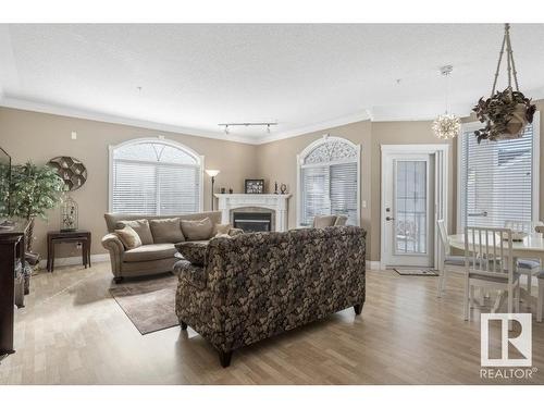 404 10178 117 Street, Edmonton, AB - Indoor Photo Showing Living Room With Fireplace