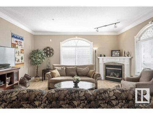 404 10178 117 Street, Edmonton, AB - Indoor Photo Showing Living Room With Fireplace