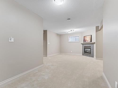 6011 Stinson Road, Edmonton, AB - Indoor Photo Showing Other Room With Fireplace