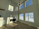 25 Baker Street, Ardrossan, AB  - Indoor Photo Showing Other Room With Fireplace 