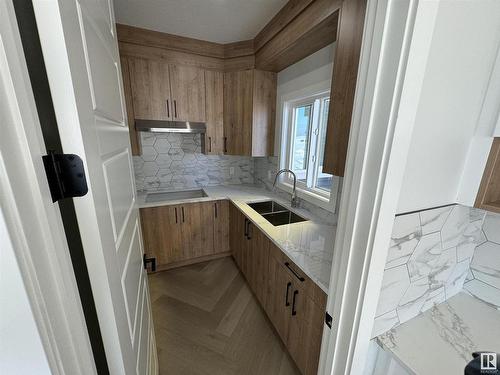 25 Baker Street, Ardrossan, AB - Indoor Photo Showing Kitchen With Double Sink With Upgraded Kitchen