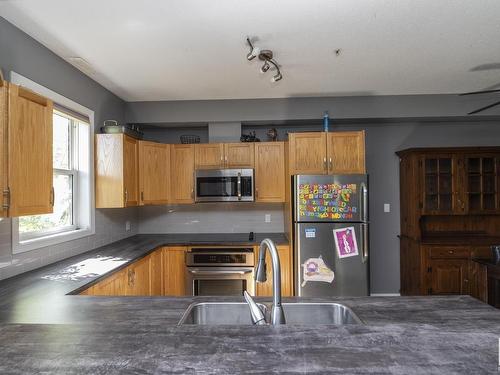 103 10711 83 Avenue, Edmonton, AB - Indoor Photo Showing Kitchen With Double Sink