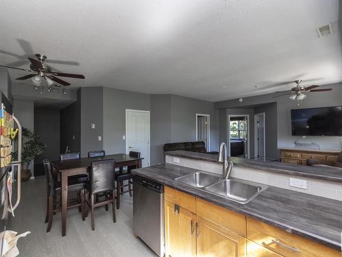 103 10711 83 Avenue, Edmonton, AB - Indoor Photo Showing Kitchen With Double Sink