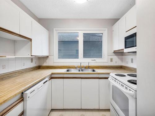 8704 128 Avenue, Edmonton, AB - Indoor Photo Showing Kitchen With Double Sink