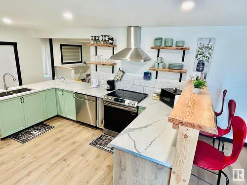 3602 50Th Avenue, Sylvan Lake, AB - Indoor Photo Showing Kitchen With Double Sink