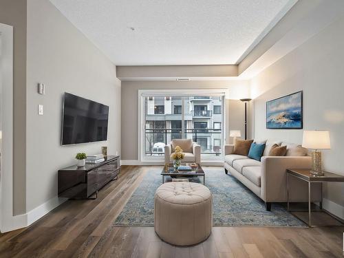 223 524 Griesbach Parade, Edmonton, AB - Indoor Photo Showing Living Room