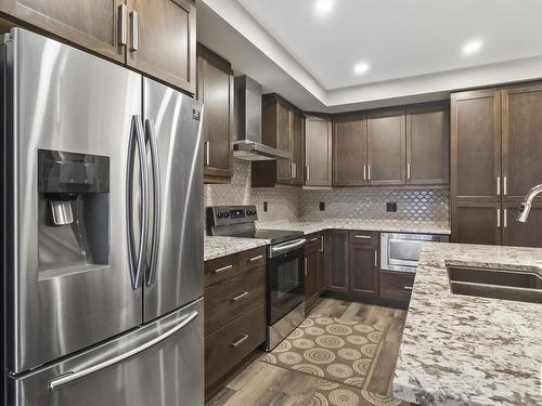 223 524 Griesbach Parade, Edmonton, AB - Indoor Photo Showing Kitchen With Stainless Steel Kitchen With Upgraded Kitchen