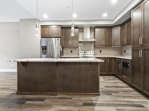 223 524 Griesbach Parade, Edmonton, AB - Indoor Photo Showing Kitchen With Stainless Steel Kitchen With Upgraded Kitchen