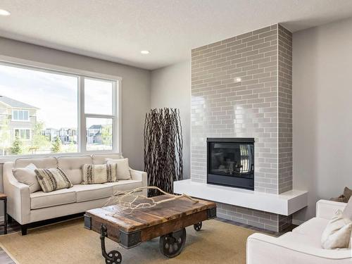 7117 51 Avenue, Beaumont, AB - Indoor Photo Showing Living Room With Fireplace