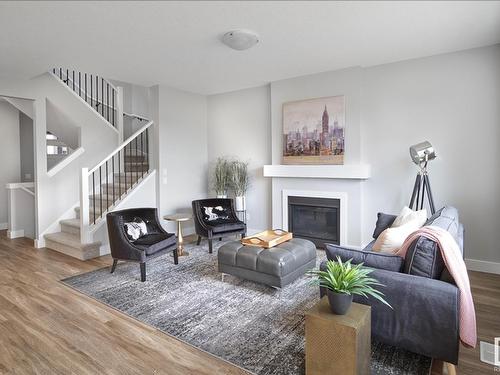 7117 51 Avenue, Beaumont, AB - Indoor Photo Showing Living Room With Fireplace