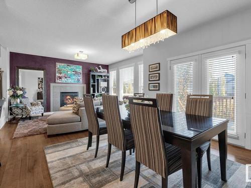 7731 Getty Wynd, Edmonton, AB - Indoor Photo Showing Dining Room With Fireplace