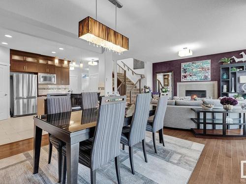 7731 Getty Wynd, Edmonton, AB - Indoor Photo Showing Dining Room With Fireplace