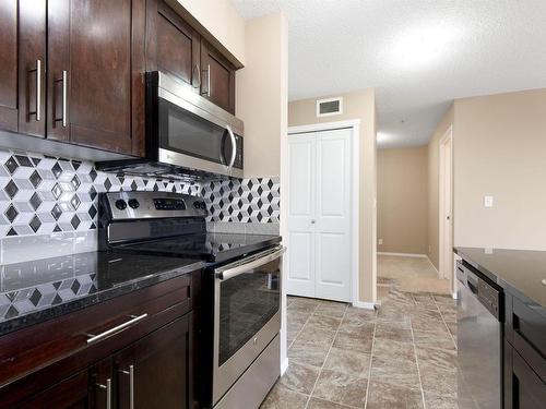 309 3207 James Mowatt Trail, Edmonton, AB - Indoor Photo Showing Kitchen With Stainless Steel Kitchen