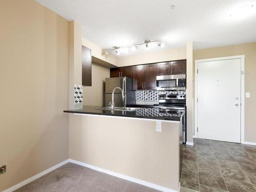 309 3207 James Mowatt Trail, Edmonton, AB - Indoor Photo Showing Kitchen With Stainless Steel Kitchen