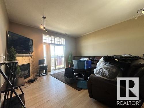 312 2503 Hanna Crescent, Edmonton, AB - Indoor Photo Showing Living Room With Fireplace