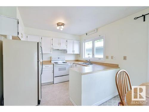 4507 51 Street, Millet, AB - Indoor Photo Showing Kitchen With Double Sink