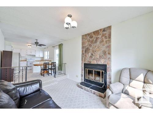 4507 51 Street, Millet, AB - Indoor Photo Showing Living Room With Fireplace