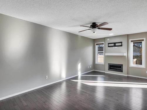 5325 15 Avenue, Edmonton, AB - Indoor Photo Showing Other Room With Fireplace